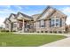 Charming single-Gathering home with a beautifully manicured lawn and attractive stone and brick exterior at 3342 Challenger Dr, Plainfield, IN 46168