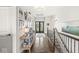 Elegant hallway with hardwood floors, artful decor, and a view of the home's entrance at 3342 Challenger Dr, Plainfield, IN 46168
