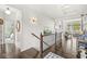 Bright hallway with dark wood floors, white walls, and a glimpse into an adjacent bedroom and living room at 3342 Challenger Dr, Plainfield, IN 46168