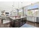 Bright kitchen with a view of the living room, large center island, and lots of natural light at 3342 Challenger Dr, Plainfield, IN 46168