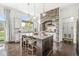 Kitchen features a stone archway, stainless steel appliances, and breakfast bar seating at the center island at 3342 Challenger Dr, Plainfield, IN 46168