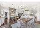 Spacious kitchen showcasing stone archway over cooktop, a center island, and a dining area at 3342 Challenger Dr, Plainfield, IN 46168