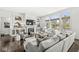 Expansive living room featuring hardwood floors, fireplace, large windows and neutral furnishings at 3342 Challenger Dr, Plainfield, IN 46168