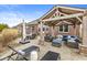 Spacious outdoor patio with covered pergola, lounge chairs, dining table, and comfortable seating area at 3342 Challenger Dr, Plainfield, IN 46168