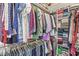 Organized walk-in closet featuring hanging rods, shelves and drawers for clothing and accessories at 3342 Challenger Dr, Plainfield, IN 46168