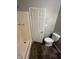 Functional bathroom featuring a shower, toilet, and modern fixtures with a tiled floor at 3830 Aloda St, Indianapolis, IN 46203