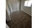 Inviting bedroom with plush carpeting, natural light, and a sliding door for easy access to the backyard at 3830 Aloda St, Indianapolis, IN 46203