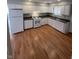 Bright kitchen featuring white cabinets, stainless appliances, and a window for natural light at 3830 Aloda St, Indianapolis, IN 46203