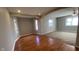 Open-concept living area with wood floors and stylish archways at 3830 Aloda St, Indianapolis, IN 46203