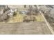 Aerial view displaying houses in an area bordering a field, illustrating a blend of residential and rural landscapes at 4251 W 176Th St, Sheridan, IN 46069