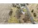 An aerial view displaying property with a house next to open fields, capturing the property's peaceful, country atmosphere at 4251 W 176Th St, Sheridan, IN 46069