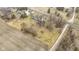A high-angle aerial shot presenting residences adjacent to fields, showcasing the property's quiet, rural setting at 4251 W 176Th St, Sheridan, IN 46069
