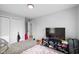 Bedroom featuring a double closet, carpeted floor, neutral color and a television and entertainment center at 4407 Barnor Dr, Indianapolis, IN 46226