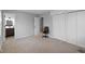 Bedroom features neutral carpet, closet, office chair, and connects to bathroom at 4407 Barnor Dr, Indianapolis, IN 46226