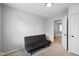 Bedroom featuring neutral paint, carpet, and a dark futon at 4407 Barnor Dr, Indianapolis, IN 46226