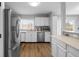 Modern kitchen features white cabinets, stainless steel appliances, and sleek countertops at 4407 Barnor Dr, Indianapolis, IN 46226