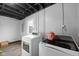 Laundry room with painted walls, updated washer and dryer units and tile flooring for ease of care at 4407 Barnor Dr, Indianapolis, IN 46226