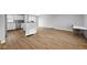 Open-concept living room features hardwood floors and white paint, creating a bright and airy space at 4407 Barnor Dr, Indianapolis, IN 46226