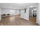 Open living space features hardwood floors, a sliding door and flows seamlessly into the kitchen at 4407 Barnor Dr, Indianapolis, IN 46226