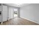 Open living space features hardwood floors, a sliding door and a well-lit area at 4407 Barnor Dr, Indianapolis, IN 46226