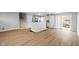 Bright living space with hardwood floors seamlessly connects the living room and kitchen at 4407 Barnor Dr, Indianapolis, IN 46226