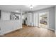 Open living space features hardwood floors, a sliding door and flows seamlessly into the kitchen at 4407 Barnor Dr, Indianapolis, IN 46226
