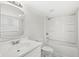 Clean, all-white bathroom featuring a tub-shower combination and vanity at 524 S State St, Greenfield, IN 46140