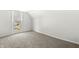 Neutral bedroom featuring neutral carpet, a window, and freshly painted walls at 524 S State St, Greenfield, IN 46140