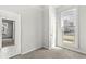Bright bedroom with carpet floors, a large window, and white walls at 524 S State St, Greenfield, IN 46140
