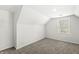 Bright, carpeted bedroom with a large window for natural light at 524 S State St, Greenfield, IN 46140