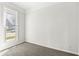 Well-lit, carpeted bedroom featuring a large window at 524 S State St, Greenfield, IN 46140