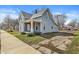 View of house with blue siding, covered front porch, and a well-maintained lawn at 524 S State St, Greenfield, IN 46140