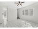 Open living room featuring tiled floors, plenty of natural light, and a ceiling fan at 524 S State St, Greenfield, IN 46140