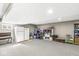 Unfinished basement area with carpet, lots of space and a fridge at 5806 Belvista Dr, Plainfield, IN 46168