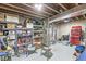 Unfinished basement area with shelving, utility equipment, and concrete walls at 5806 Belvista Dr, Plainfield, IN 46168