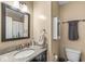 Functional bathroom featuring a granite-topped vanity, updated fixtures, and a shower-tub combo with a cactus-themed curtain at 5806 Belvista Dr, Plainfield, IN 46168