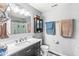 Bathroom has a dark vanity, lots of mirror space and a walk-in shower at 5806 Belvista Dr, Plainfield, IN 46168