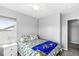 This bedroom has a ceiling fan, carpet and a window bringing in natural light at 5806 Belvista Dr, Plainfield, IN 46168