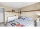 Bedroom with a dresser, carpet, tan walls and motorcycle decor at 5806 Belvista Dr, Plainfield, IN 46168