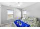 Bright bedroom features plush carpet, natural light, and a ceiling fan at 5806 Belvista Dr, Plainfield, IN 46168