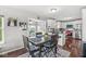 Cozy dining area with a kitchen view, wooden table, and stylish decor at 5806 Belvista Dr, Plainfield, IN 46168