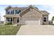 Attractive two-story home featuring brick accents and a well-maintained lawn at 5806 Belvista Dr, Plainfield, IN 46168