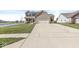 Charming two-story home with brick facade, wide driveway, and landscaping at 5806 Belvista Dr, Plainfield, IN 46168