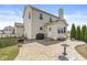 Exterior shot of the home, showcasing patio, manicured lawn and house's back entrance at 5806 Belvista Dr, Plainfield, IN 46168