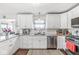 Clean kitchen featuring white cabinets, granite counters, and stainless appliances for a modern look and feel at 5806 Belvista Dr, Plainfield, IN 46168