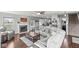 Inviting living room showcasing a fireplace, hardwood floors, and comfortable seating at 5806 Belvista Dr, Plainfield, IN 46168