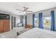 Spacious main bedroom has a ceiling fan and large windows with nice backyard views at 5806 Belvista Dr, Plainfield, IN 46168