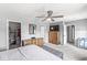 Spacious main bedroom with carpet, ceiling fan, a large dresser and access to a closet at 5806 Belvista Dr, Plainfield, IN 46168
