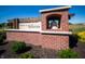Meadows at Belleview entrance sign featuring a brick structure, landscaping, and blue skies at 5899 Doorbell Ln, Greenwood, IN 46143