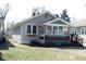 Charming home exterior with a cozy porch and well-maintained lawn at 6041 Dewey Ave, Indianapolis, IN 46219